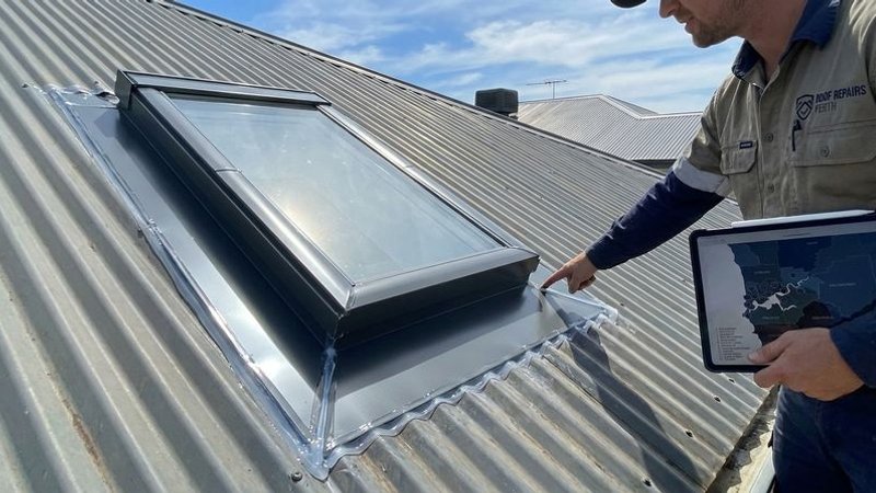 Completed leak repair on a Perth home showing new flashing sealed around a skylight penetration on a Colorbond roof